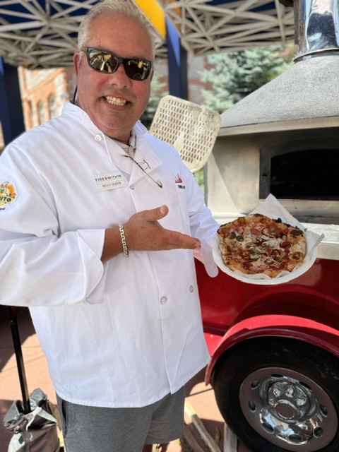 (holding special pizza)